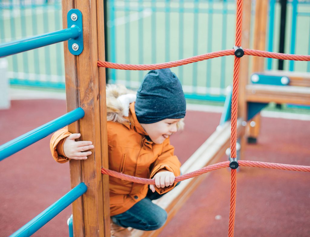 A child plays on a playground.