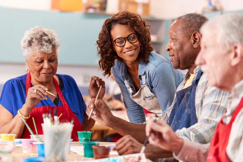 Seniors attend an art class at the community center.