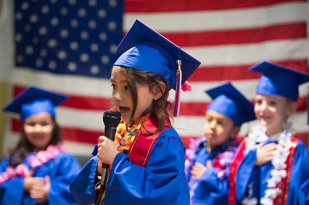 A child recites the pledge of allegiance