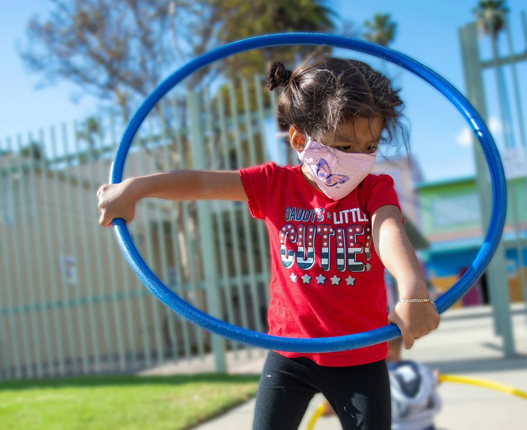 A child hula hoops at an LA County Parks event.